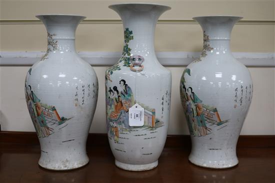 A pair of vases and one other